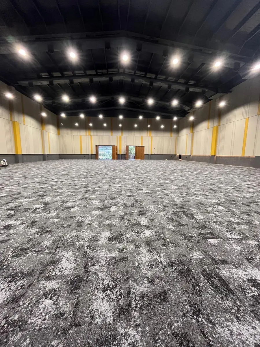 Tranquil carpet tile installation in a Hyderabad auditorium